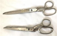 Two pairs of sewing or fabric scissors