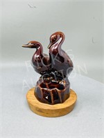 ceramic duck figures on walnut by Herta - 7"