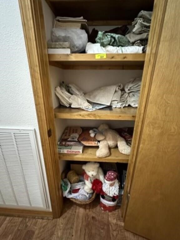 Linens, toys, Christmas items in closet