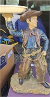 C9) Cowboy statue stand