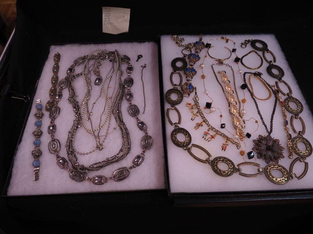 Two containers of costume jewelry, necklaces and