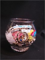 Container of costume jewelry, button covers,