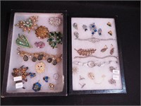 Two containers of rhinestone jewelry including