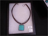 Sterling and turquoise pendant on a