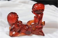 An Amber Resin Erotica Figurine