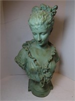 Metal bust of woman