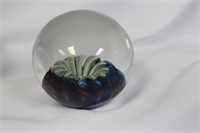 A Signed HAT Glass paperweight