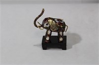 A Small Chinese Cloisonne Elephant on Stand