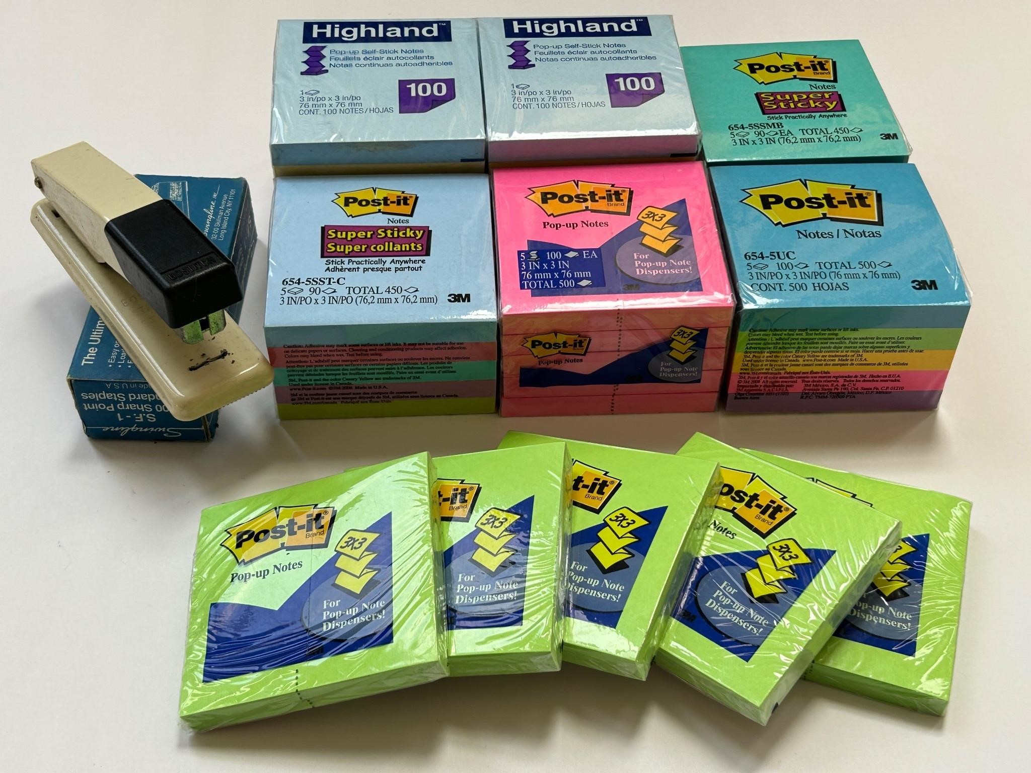Collection of Post It notes and a stapler