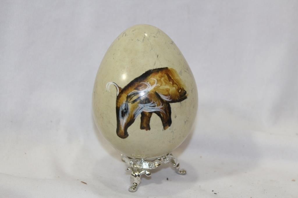 A Painted Stone Egg on Stand