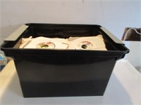 PLASTIC CONTAINER OF OLD 45 RPM RECORDS