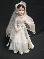 Hard plastic fashion doll in wedding dress,