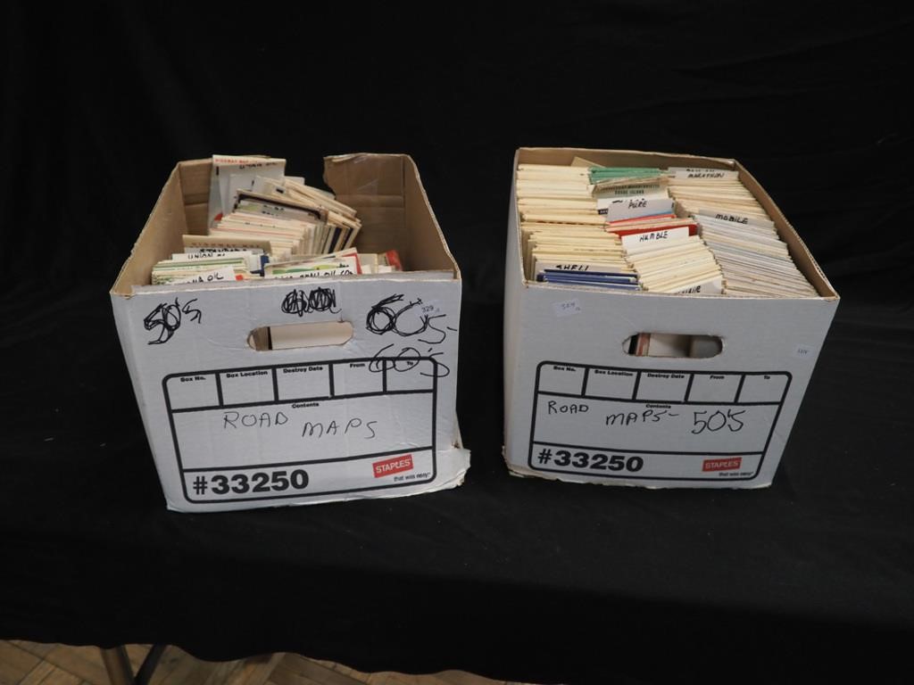 Two boxes of state and city maps from 1950s and