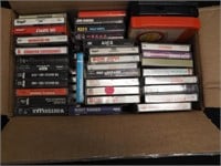 Box of mostly cassette tapes including KISS,