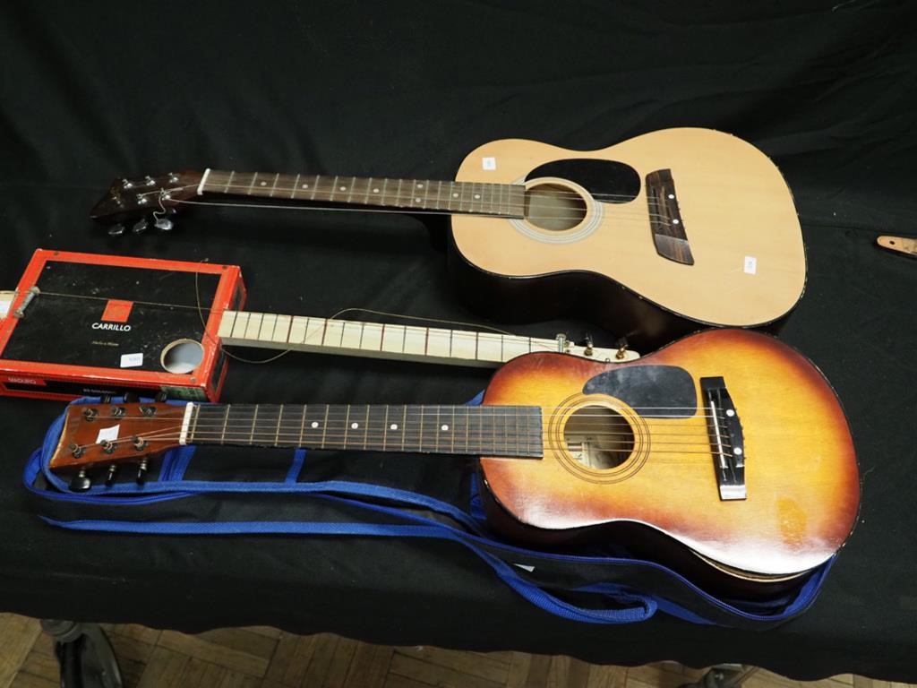 Two youth guitars and cigar box guitar