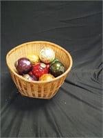 Basket of Christmas ornaments including seven