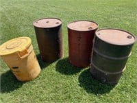 3 metal barrels and 1 plastic feed can