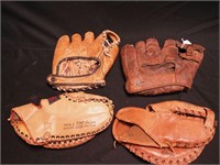 Four vintage baseball gloves: TMC first
