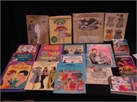 Several paper doll books, three VHS children's