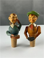 Two vintage wooden figural bottle stopped