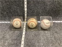 Baseballs in Cases