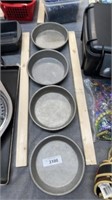 Four heavy, metal, baking pans