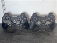 2 PlayStation 2 controllers