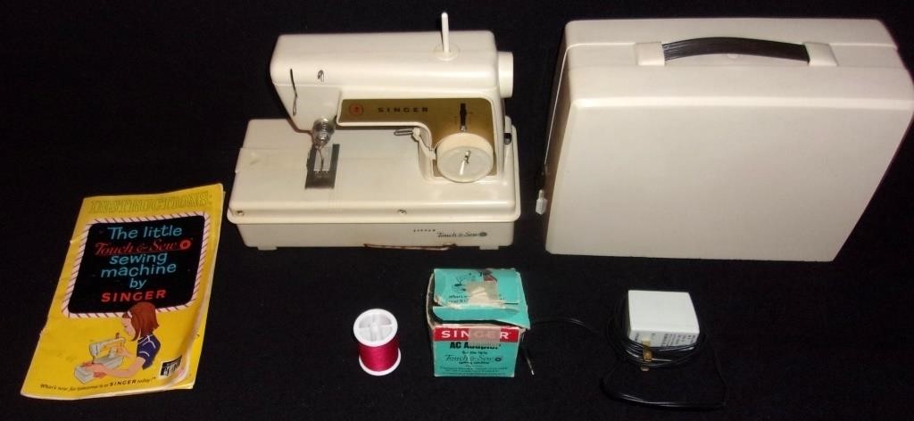 Child's portable Singer sewing machine.