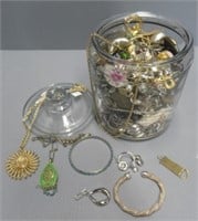 Old pickle jar full of unchecked costume jewelry.