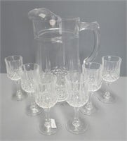 Crystal pitcher that measures 9.5" Tall with (6)