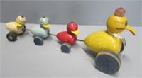 Vintage wood ducks in a row pull toy.