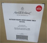 Outdoor round wood dining table by Hearth and