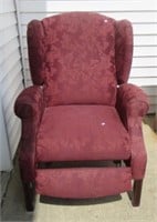 Upholstered occasional chair/recliner.