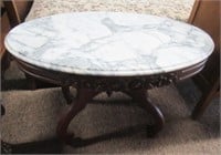 Wood and marble table. Measures: 21.5" H x 33.5"