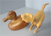 Hand carved wood duck and dog signed figures.