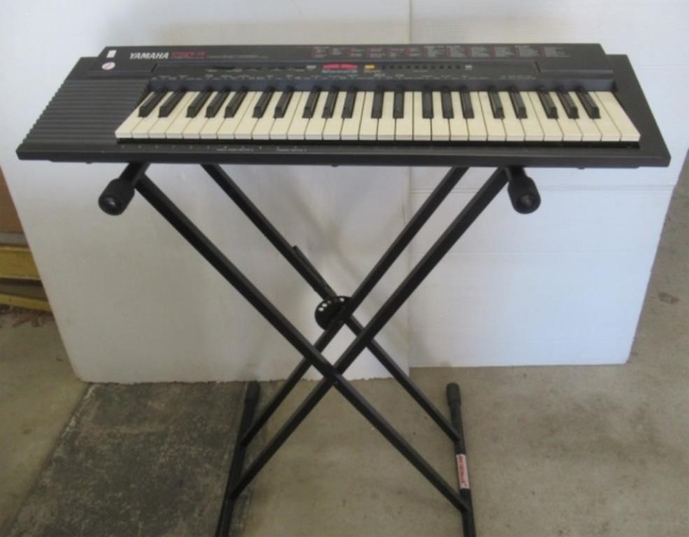 Yamaha PSR-3 keyboard with stand.