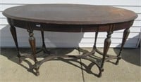 Oval table, 33"H x 55.5"W x 26"D.