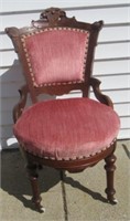 Ornate wood parlor chair.