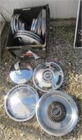 Various vintage hub caps includes Ford, Monza