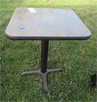 Table with metal base, 29.5"T x 23" x 24".