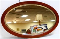 Vintage oval wood framed mirror