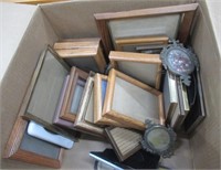Various sizes and styles of picture frames.