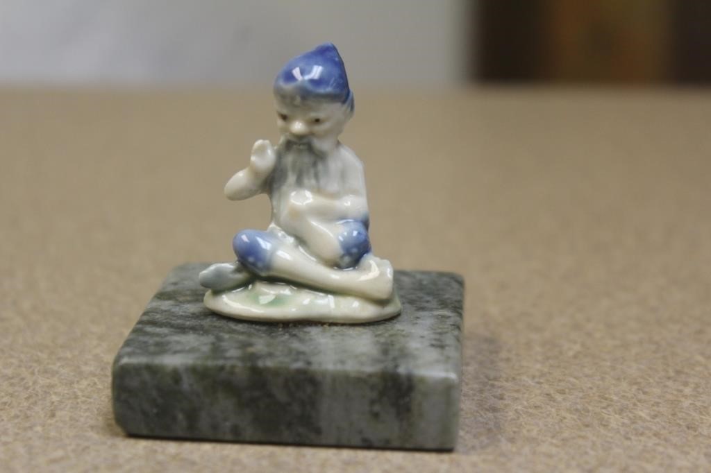 small ceramic oriental man on stand