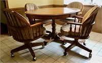 WOOD DINING TABLE AND 4 ROLLING CHAIRS