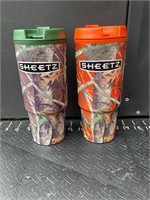 Two camouflage sheetz cups orange and green