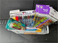 Small basket with pens, markers, and highlighters