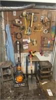 Contents on wall and floor , tools , stools, in