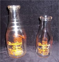 Vintage Capreol milk bottles.