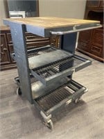 Metal shop cart with Two shelves and a tabletop.