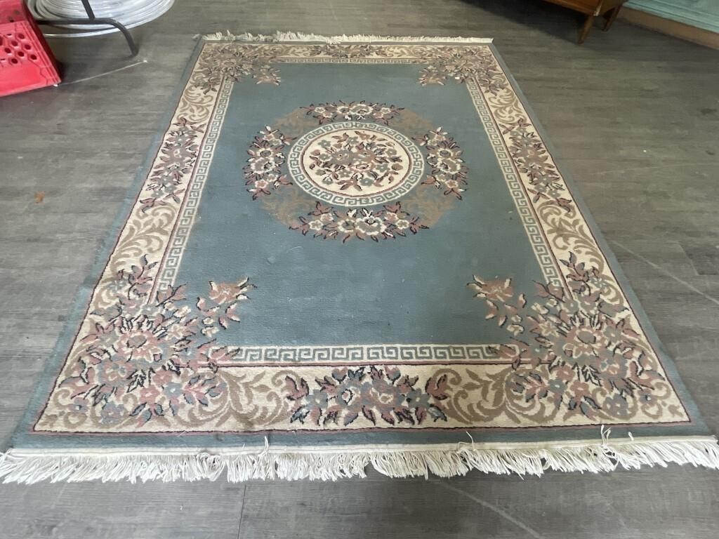 Area rug. 67" x 88” Needs cleaning.